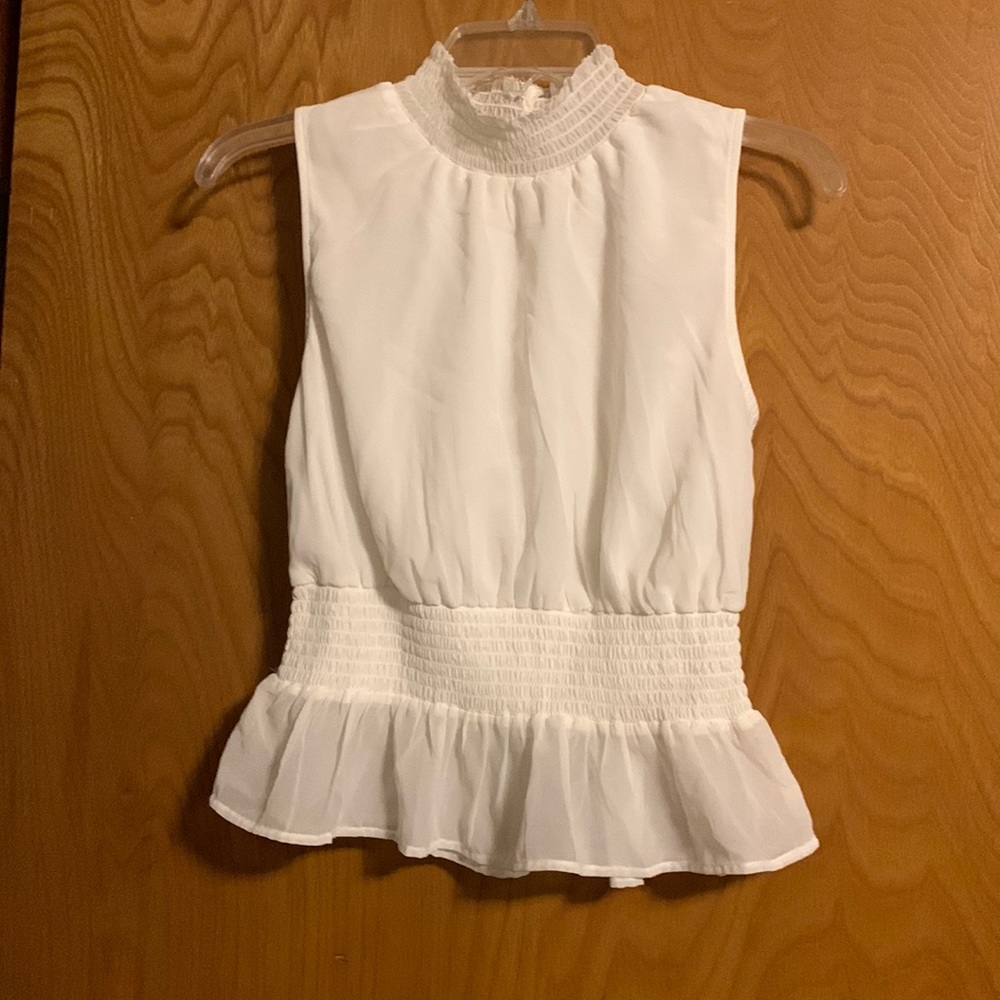 Sleeveless peplum blouse